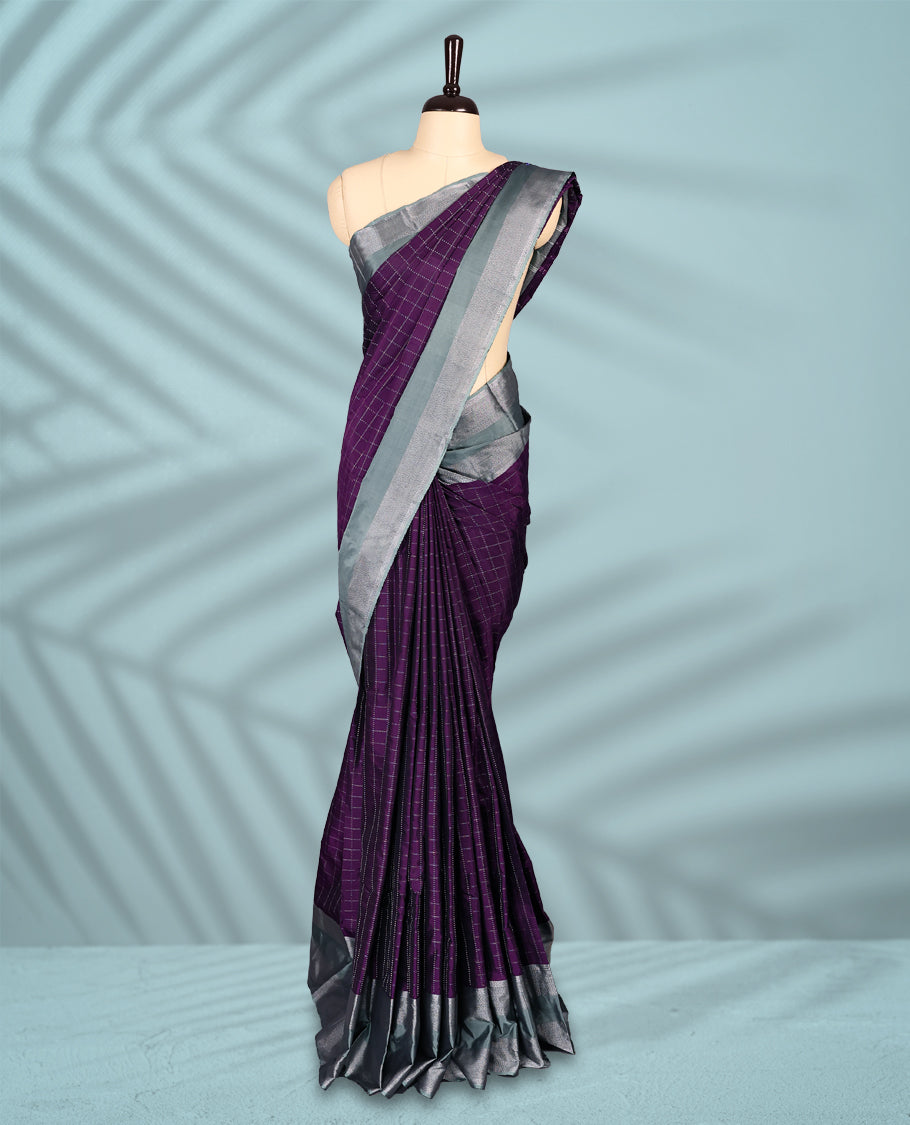 Regal purple Colour semi silk saree showcases a delicate silver zari check pattern, paired beautifully with a contrasting Ash Green border and a matching blouse