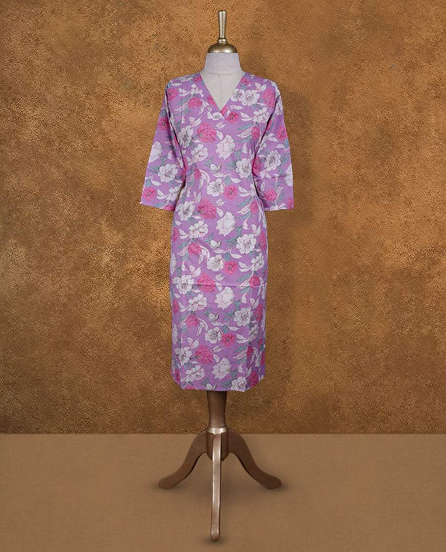Light purple colour kurti enlivened with white and fuchsia floral blooms, styled with a graceful V-neckline and easy 3/4th sleeves.
