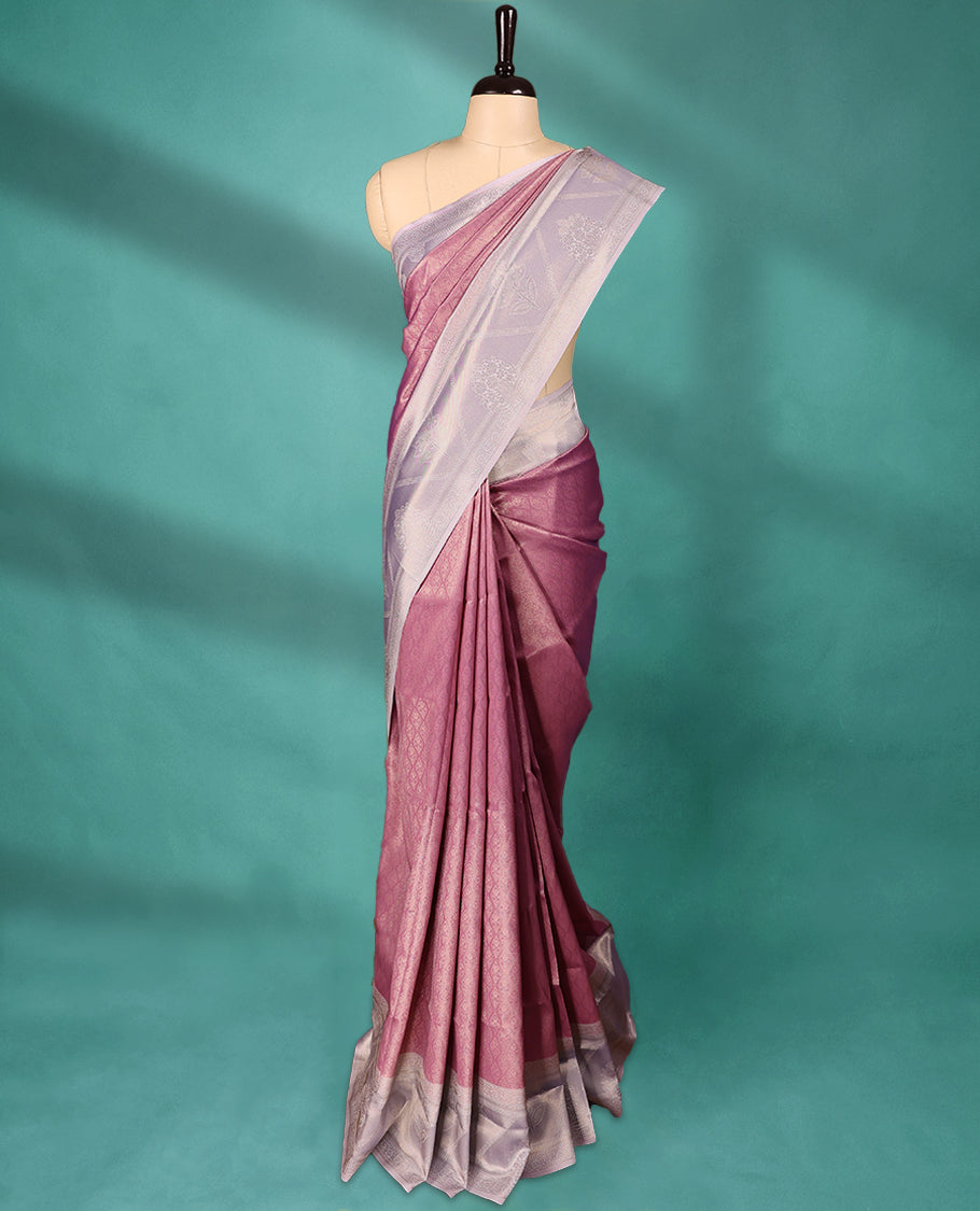 Onion coloured semi silk saree featuring a Brocade body, paired with a Light Pastel Purple coloured border and matching blouse.
