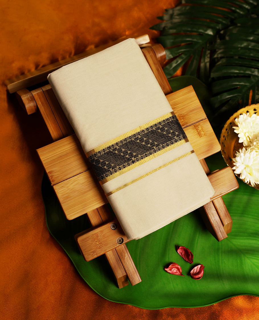 Elegant off white colour pure handloom cotton dhoti featuring an ornate black woven design bordered with golden zari, offering a perfect fusion of tradition and elegance for weddings, festivals, and cultural occasions.