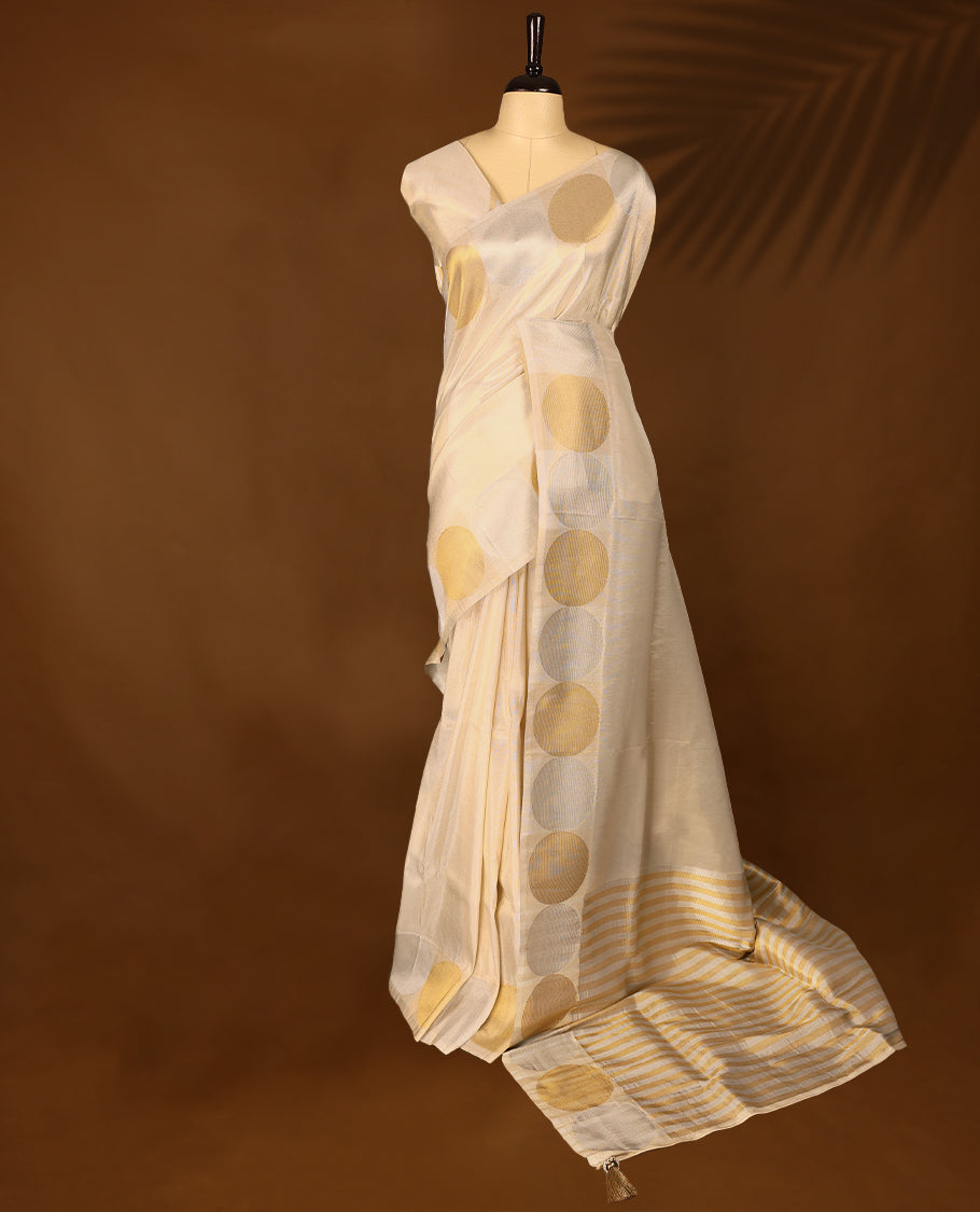 Ivory, gold and Silver soft tissue Kerala saree featuring a Plain Body, striking Circle border with a matching blouse