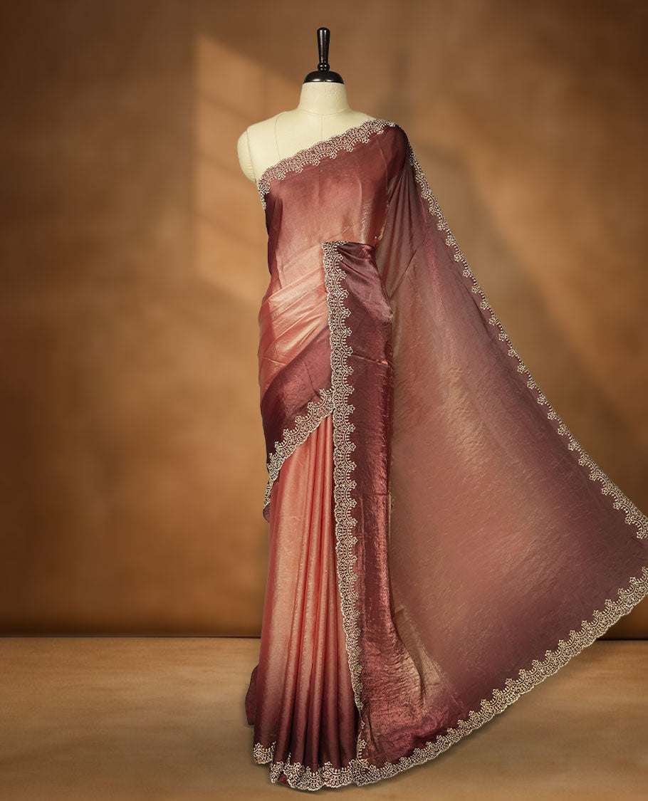 Chocolate Brown Colour shimmer fancy saree adorned body, paired with a delicate with scattered gold stone worked border and matching blouse