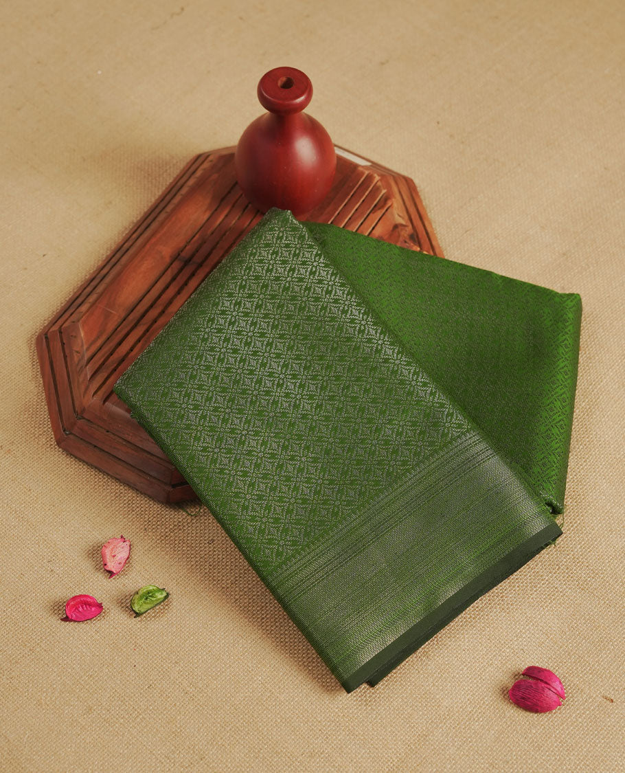 Green colour semi silk saree featuring neem zari Brocade geometric Pattern all over the body, complemented by a Self Colour woven border with detailing, Pallu & blouse.