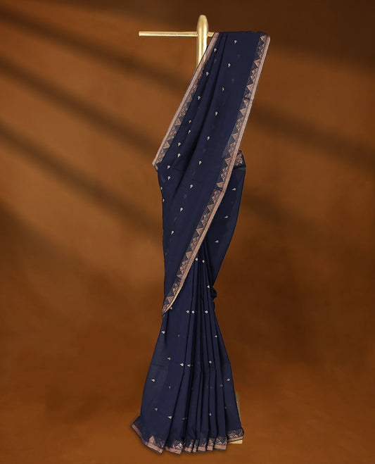 Navy Blue colour soft khadi cotton saree with small Beige Zari motifs on the body, detailed woven Gold zari border, paired pallu with tussles, with matching blouse.
