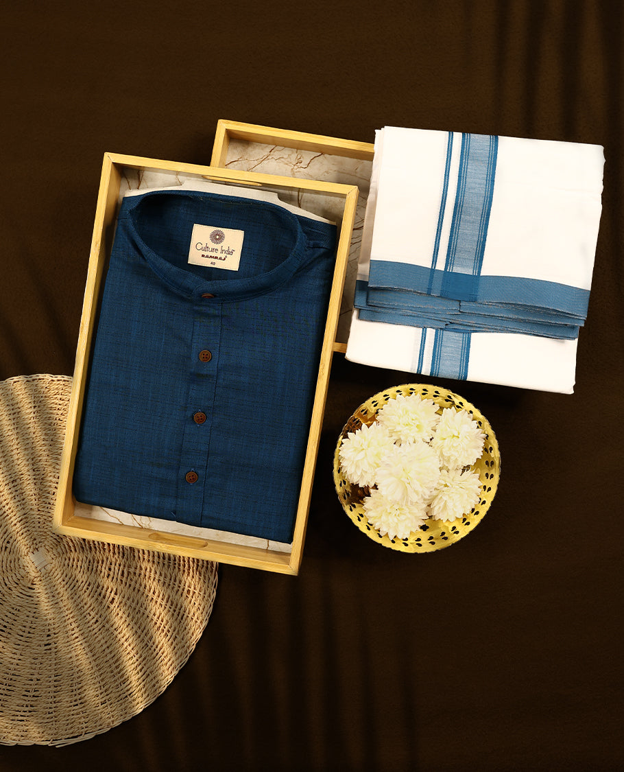 RAMRAJ Blue kurtha paired with a white dhoti, elegantly finished with a matching Blue border.