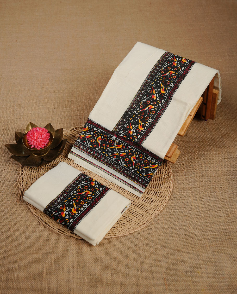 Cream colour cotton set mundu highlighting Black colour floral & birds motifs printed border.