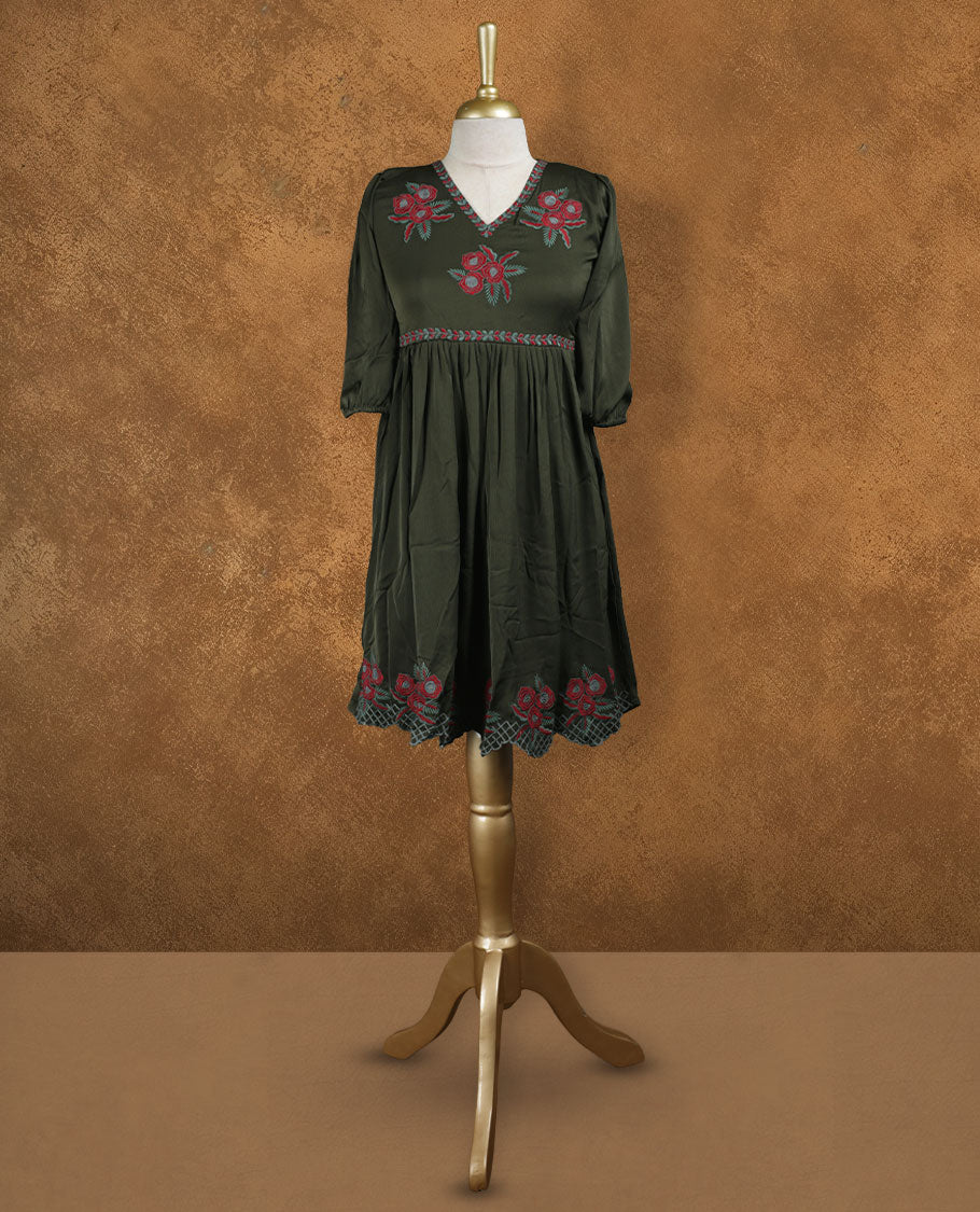 Olive green knee-length A-line dress with V-neckline, floral embroidery on yoke and hem, and elbow-length puff sleeves.