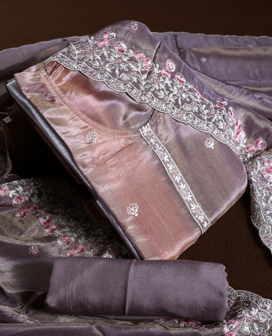 Mauve colour churidhar material with a soft sheen, adorned with pink and white floral lace embroidery & Comes with a plain matching bottom and dupatta.