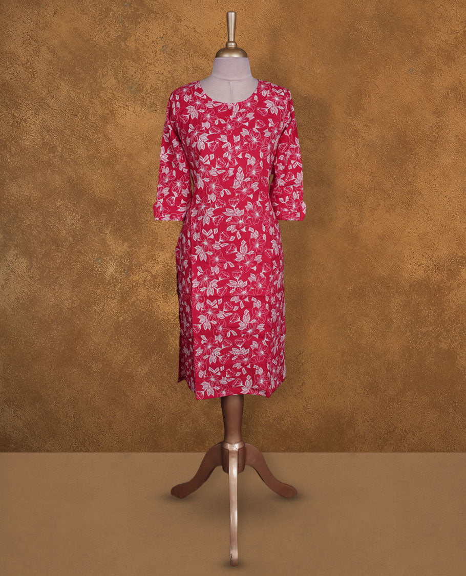 Red colour kurti with white floral prints, knee length design, styled with a round neckline and a 3/4 sleeve .
