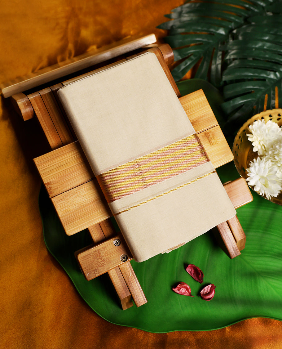 Traditional off white colour pure handloom cotton dhoti featuring a vibrant golden yellow and pink striped border, blending festive charm with comfort, making it an ideal choice for temple visits and cultural occasions.