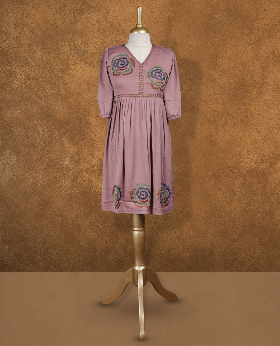 Dusty mauve knee-length A-line dress with V-neckline, multicolour spiral floral embroidery on yoke and hem, and elbow-length gathered sleeves.