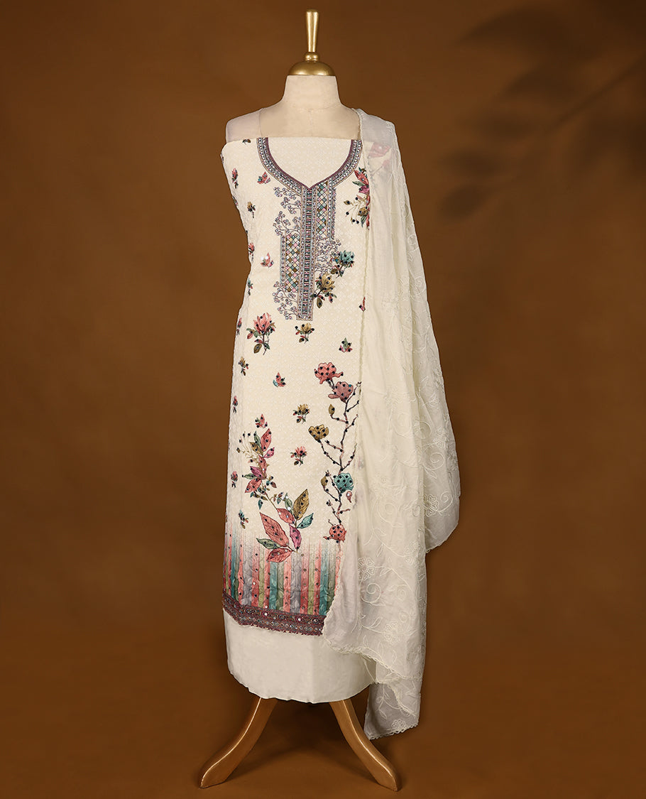 Off-white ensemble featuring a hand-embroidered top with intricate threadwork, paired with matching bottoms and a worked dupatta.