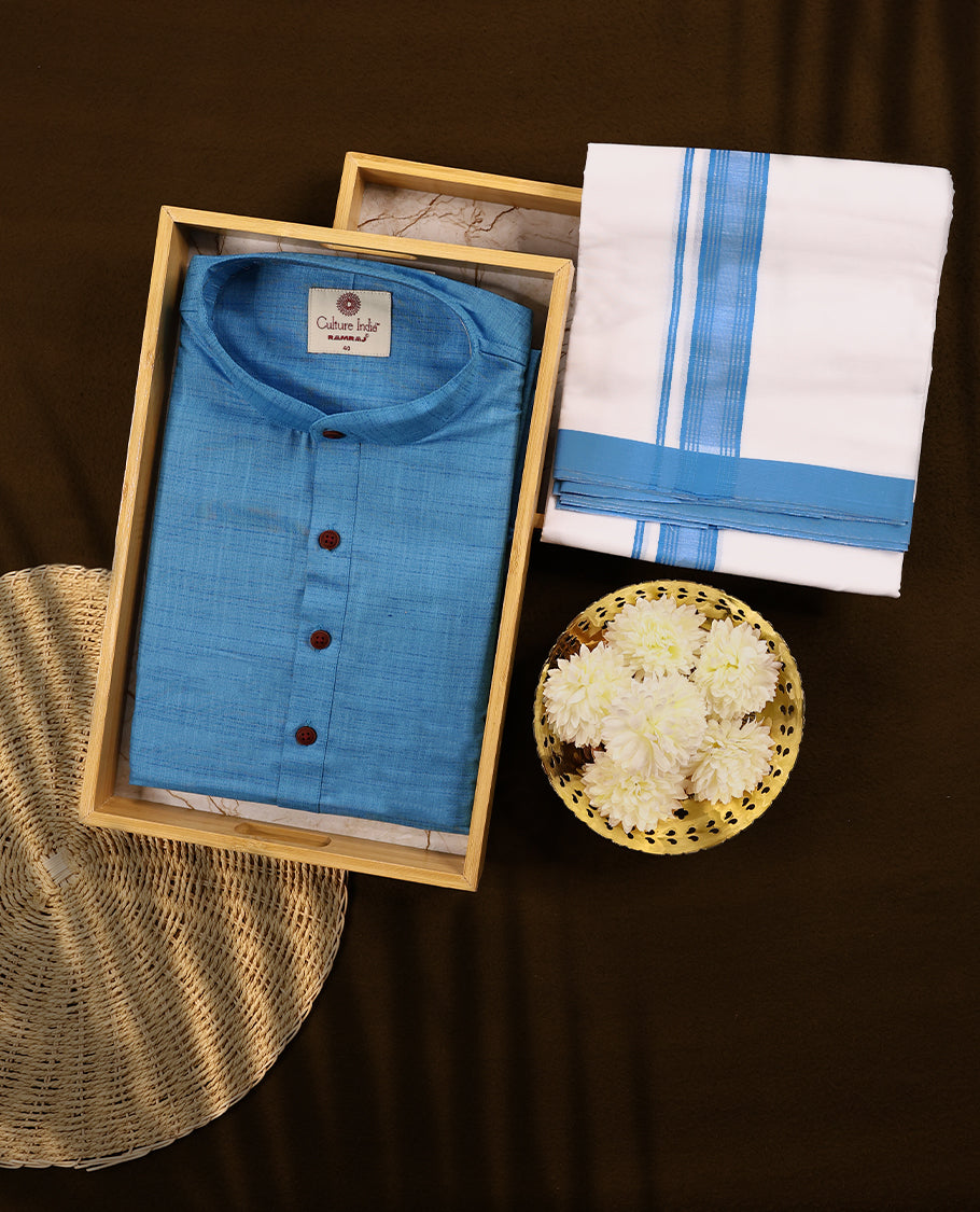 RAMRAJ Light Blue kurtha paired with a white dhoti, elegantly finished with a matching Blue border.