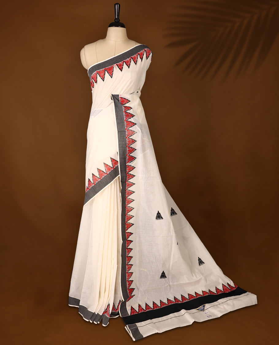 Elegant off white colour cotton Kerala saree featuring Plain body, Black colour border with red Colour temple designs, Paired with matching blouse offering a classic and graceful look, paired with a matching blouse.