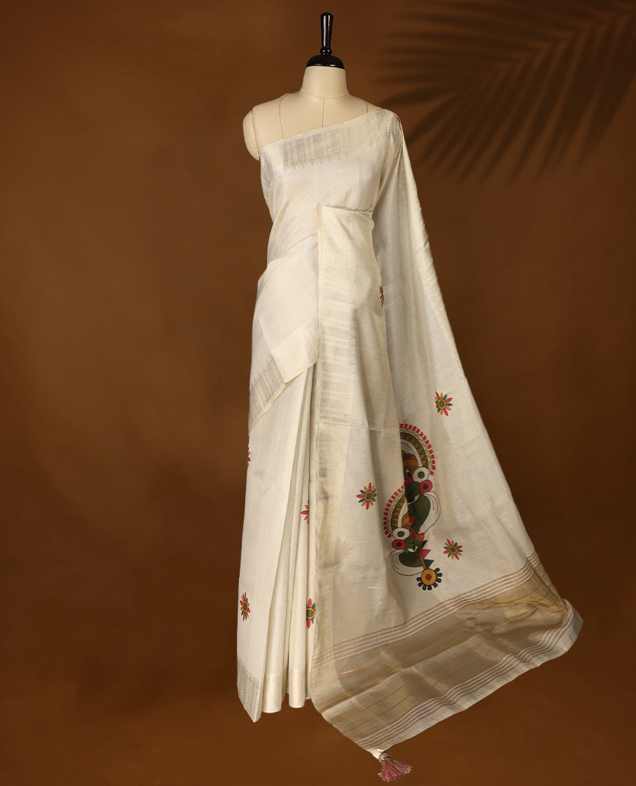 Light gold colour Organza Kerala saree featuring a sheer, smooth body, light Kasavu border, Kathakali printed pallu, Comes paired with a coordinated matching blouse.