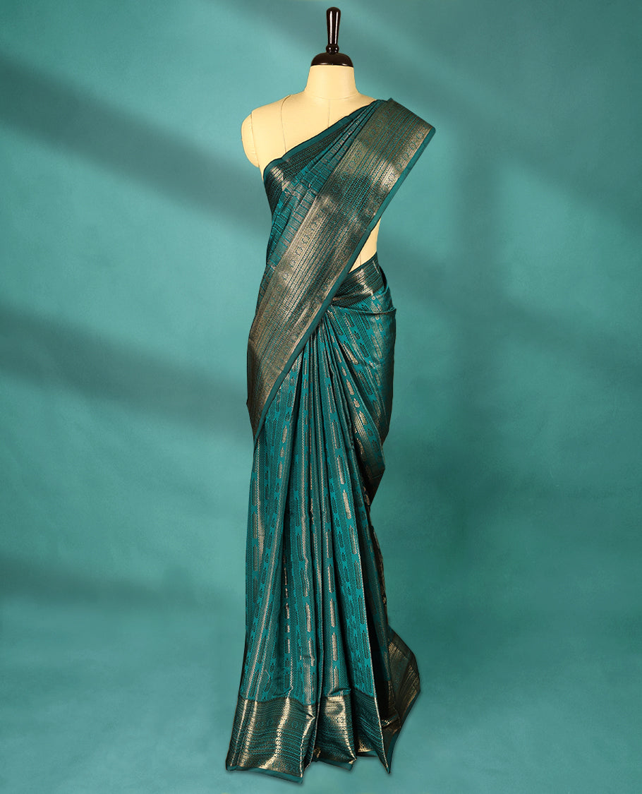 Teal Green Art Soft Silk Saree showcases intricate silver zari work on the body and border, paired with a matching blouse