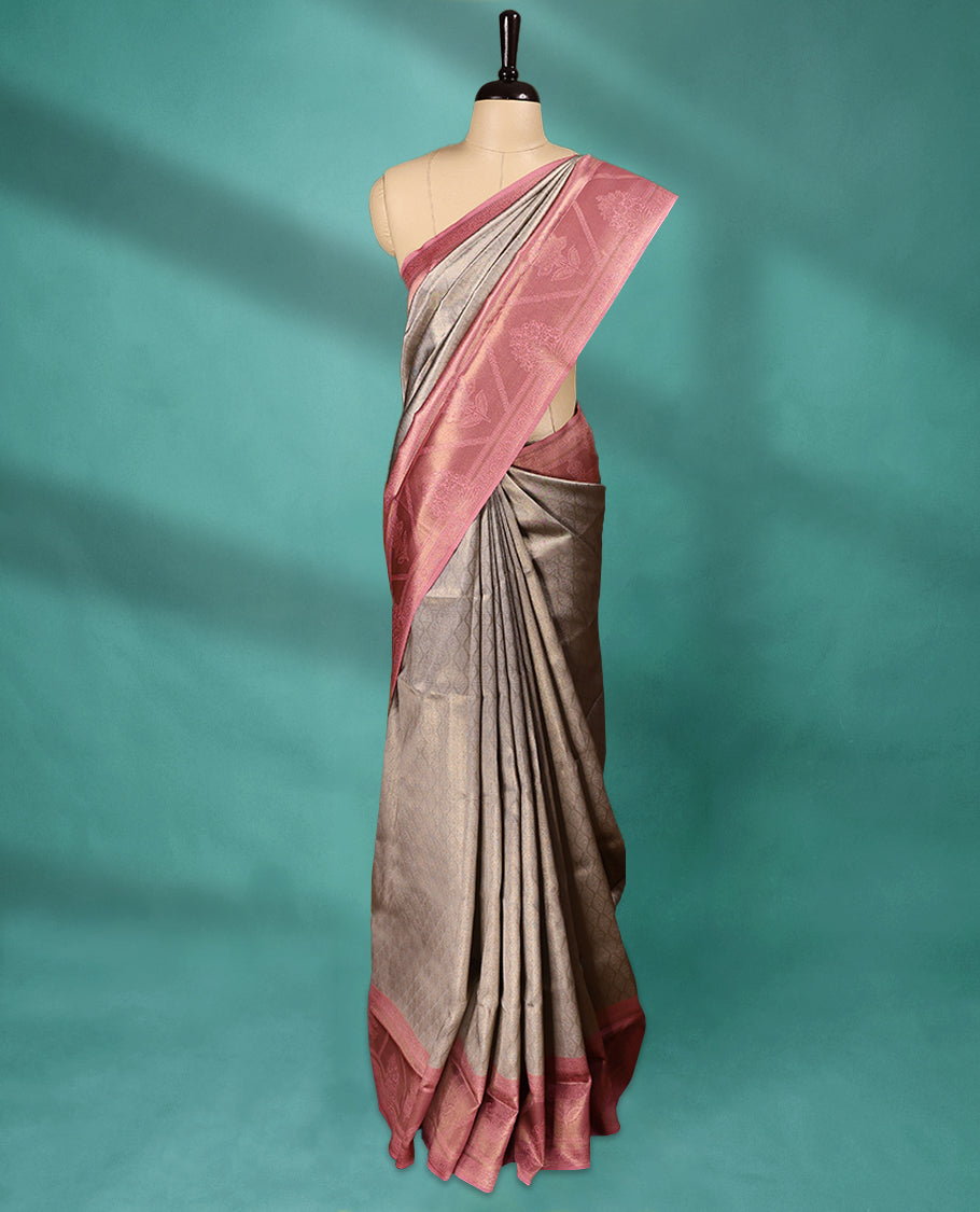 Grey coloured semi silk saree featuring a Golden Brocade body, paired with a Pastel Onion coloured border and matching blouse.