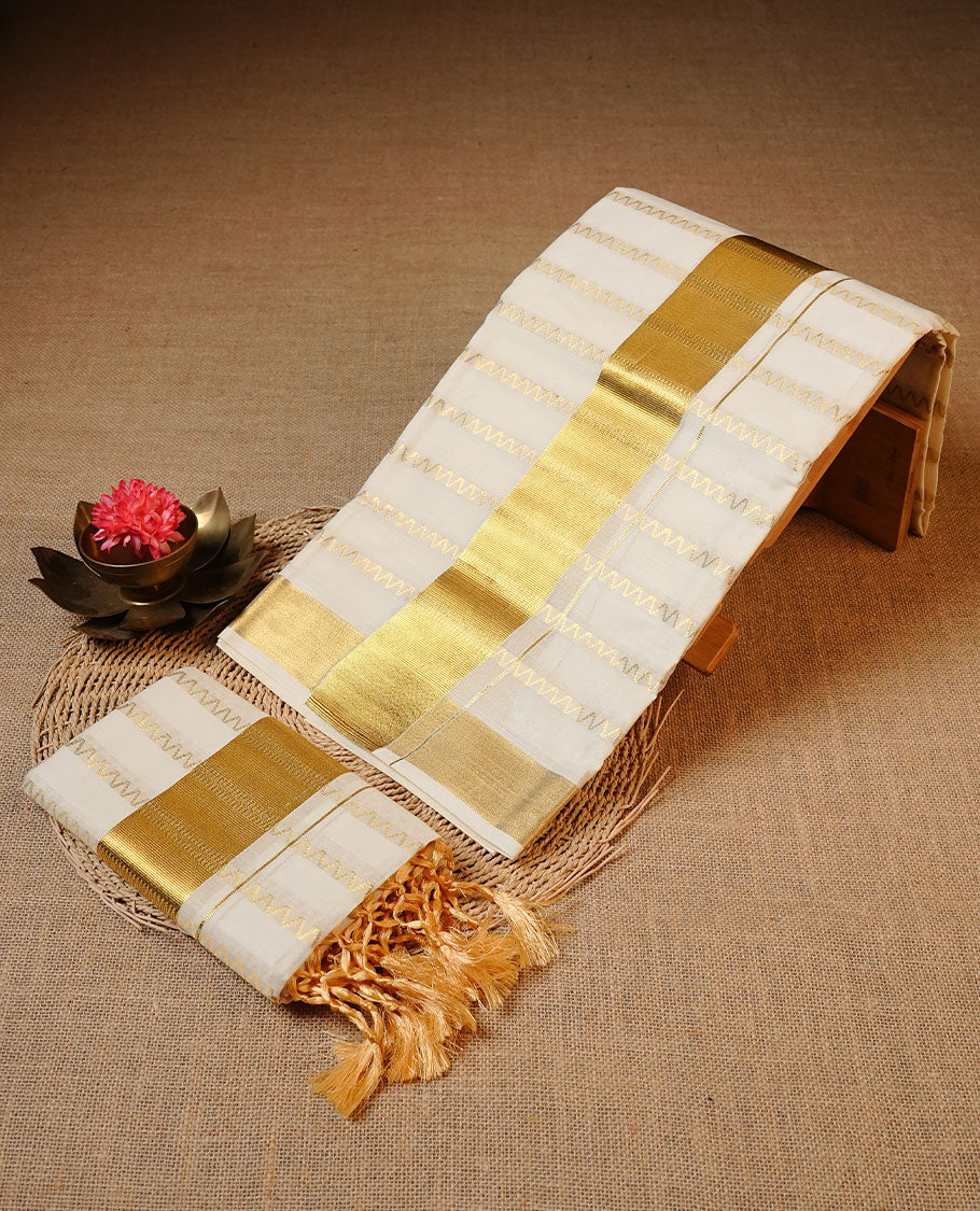 Off white colour Cotton Set Mund featuring a zigzag zari woven body, enhanced by a broad gold zari border.