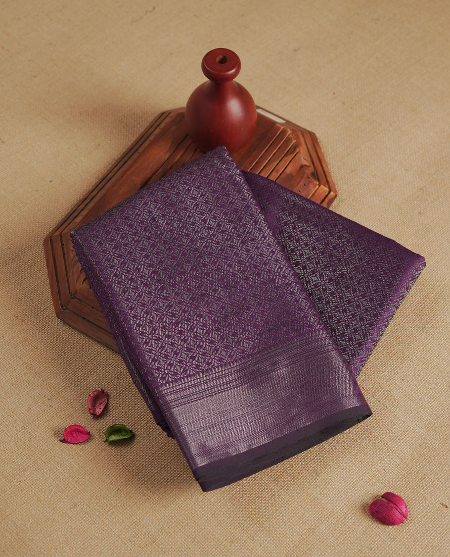 Deep Violet colour semi silk saree featuring neem zari Brocade geometric Pattern all over the body, complemented by a Self Colour woven border with detailing, Pallu & blouse.