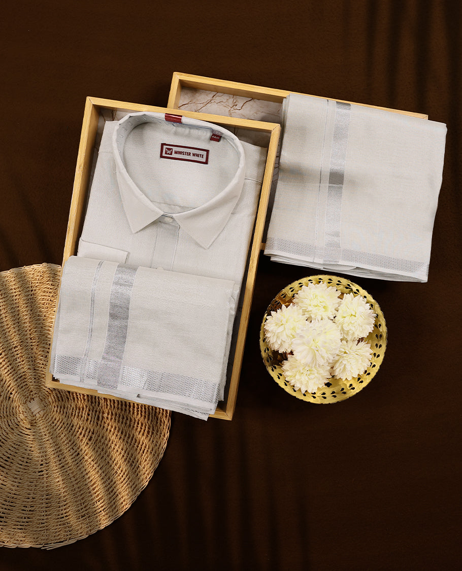 Silver tissue wedding shirt and dhoti set from MINISTER WHITE, adorned with a matching silver zari border.
