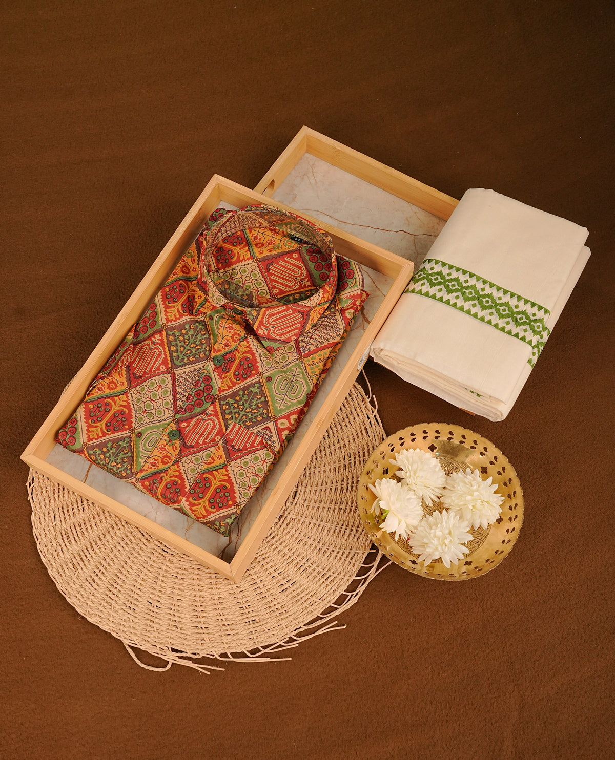 Brick red colour shirt featuring Floral Pattern printed body, paired with cream colour double dhoti featuring Green colour printed border.