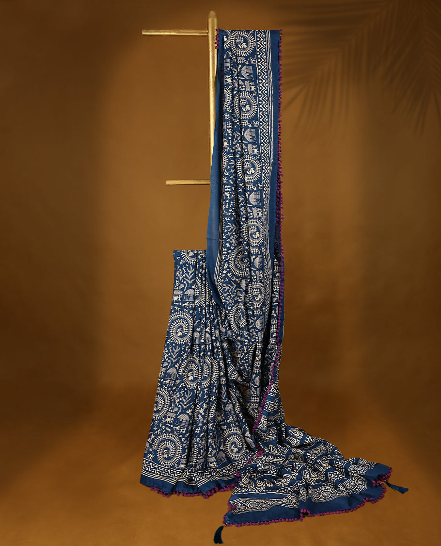 Blue cotton saree features intricate off-white handblock prints, a beautifully detailed border with Grape piping and Self Coloured Blouse