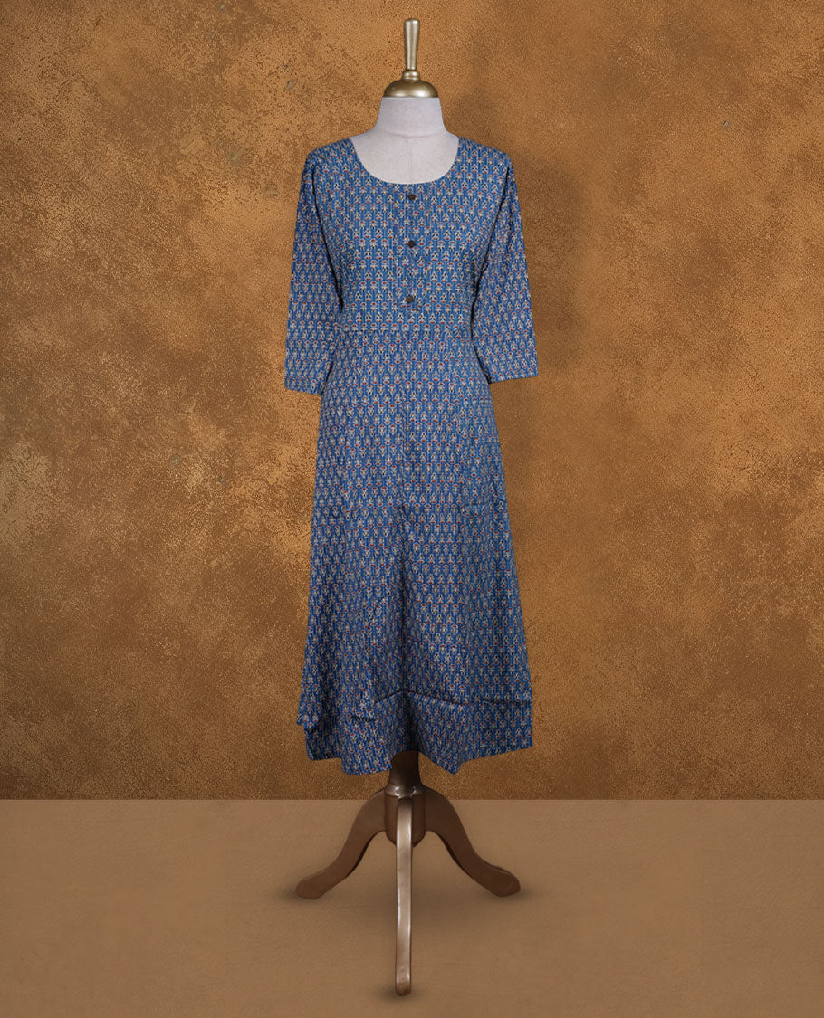 Blue colour kurti covered in tiny off‑white and red floral motifs, styled with a scoop neckline, buttoned front yoke and comfy 3/4th sleeves.