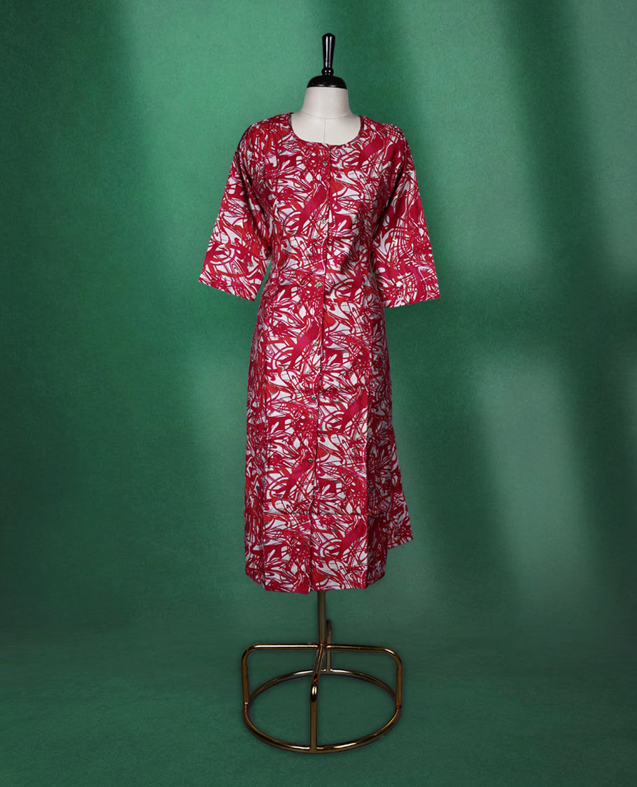 Magenta, red and white printed kurti with all over abstract patterns, featuring a round neckline, front button placket, and elbow length sleeves ideal for a bold and breezy casual look.