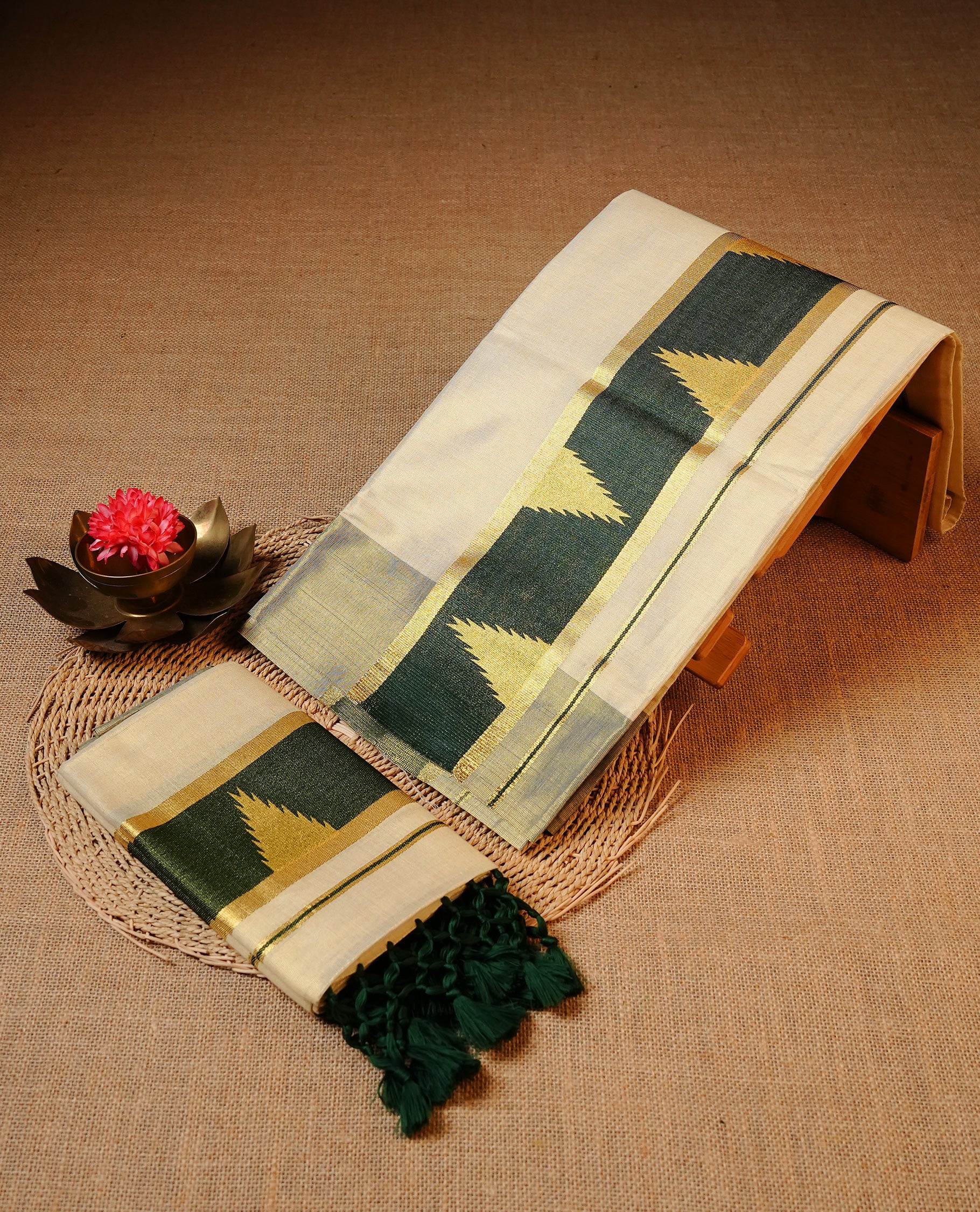 Cream colour Tissue silk set mund Featuring Elegant plain body, Complemented by Temple print on Green colour & gold zari border.