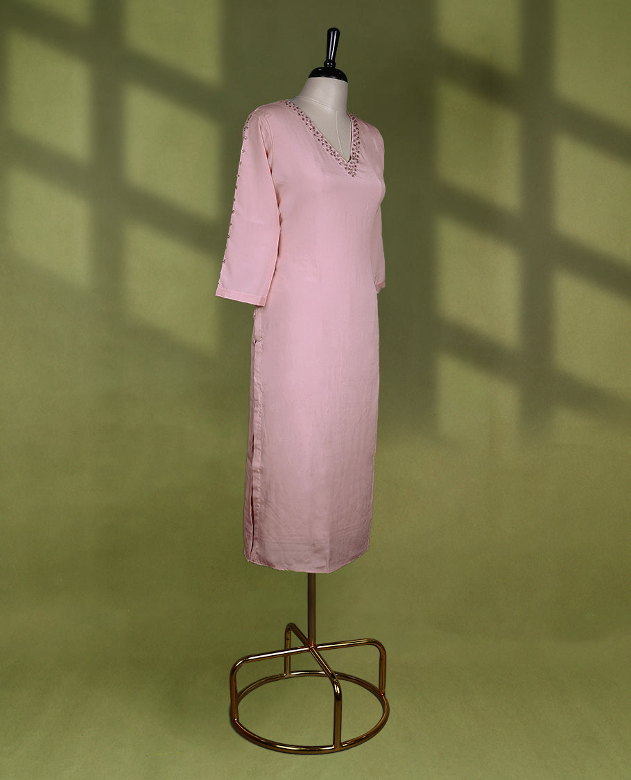 Baby pink coloured stylish kurti with slit, featuring a V neck design adorned with cut beads and sequin work, for women