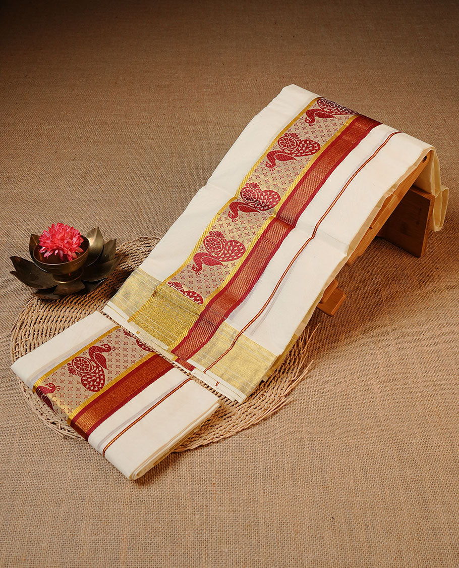 Off white colour cotton Set Mund featuring a plain body, enhanced by a traditional red and gold woven border with peacock motifs.
