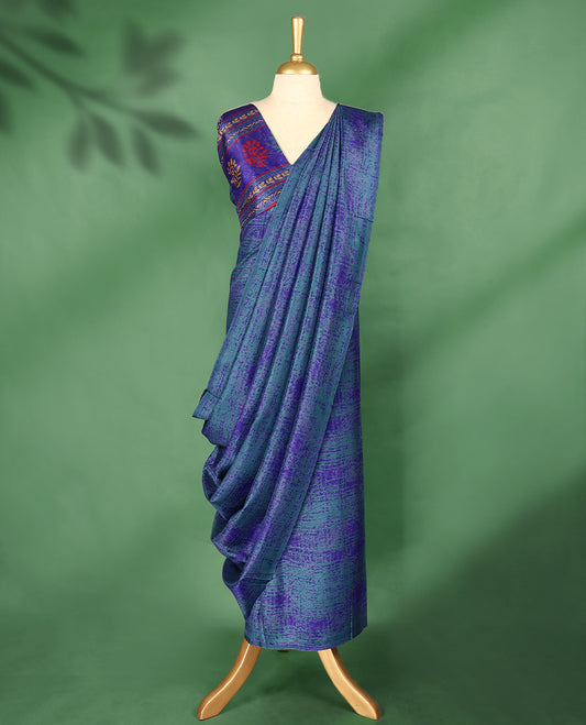 Teal blue colour Manipuri saree features a body with subtle royal blue textured patterns, without Border, and comes with a matching blouse.
