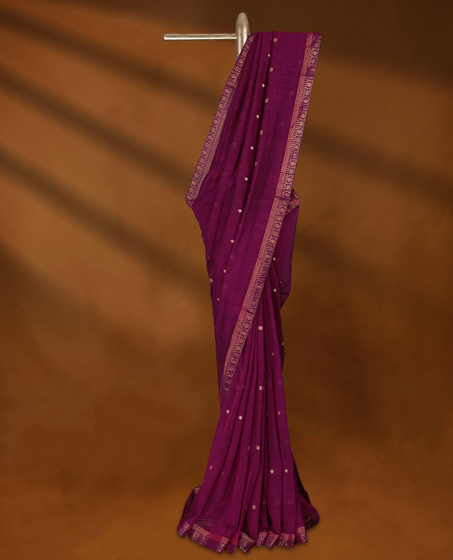 Deep Magenta colour soft khadi cotton saree with small Beige Zari Flower motifs on the body, detailed woven Gold zari border, paired pallu with tussles, with matching blouse.