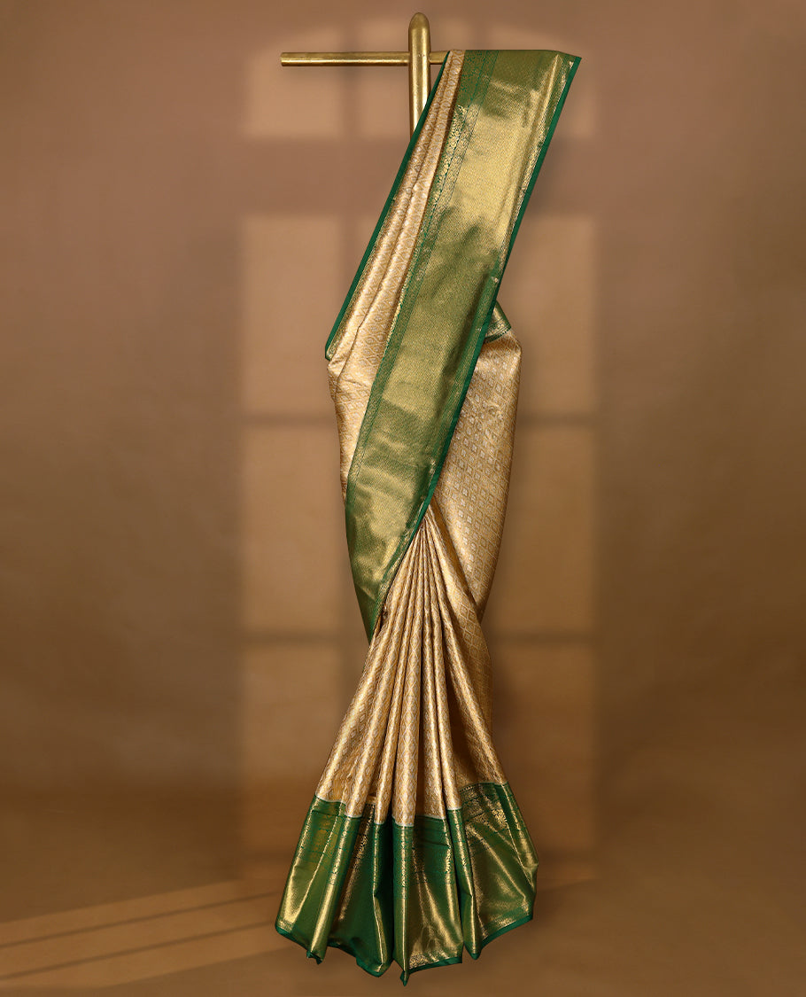 Golden Colour Tissue Semi Silk Saree having Silver Zari Worked Body and Blouse with Green Border