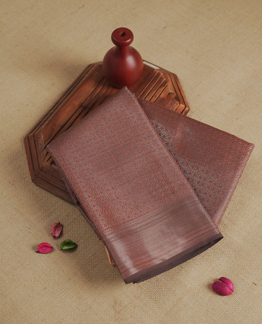 Amber brown colour semi silk saree featuring neem zari Brocade geometric Pattern all over the body, complemented by a Self Colour woven border with detailing, Pallu & blouse.