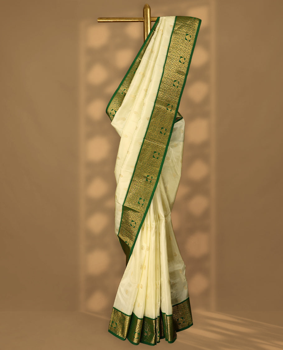 Cream Colour Vasundhara Silk Saree having Golden Thread Buttas in Body with Green Colour Border and Blouse