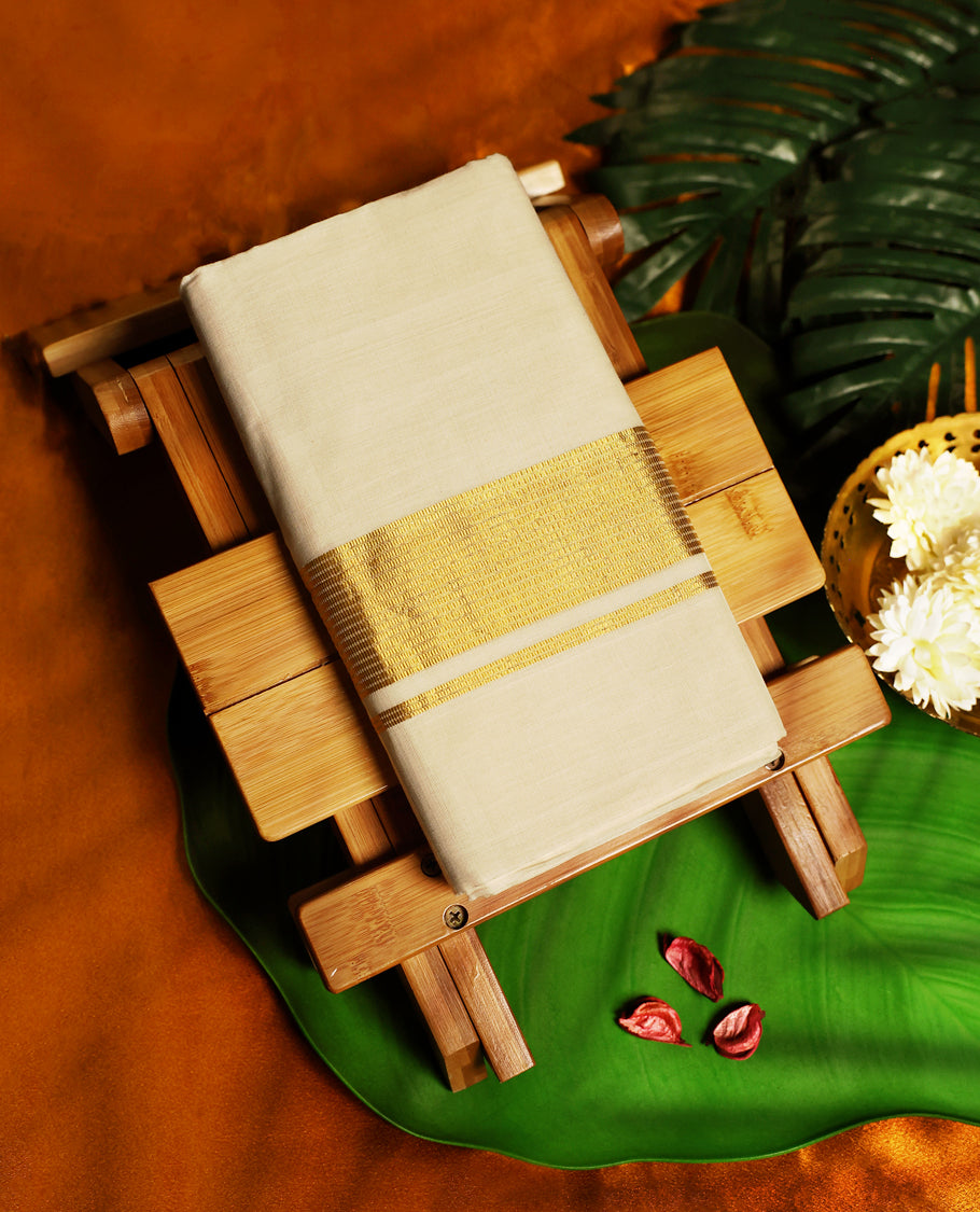 Classic off white colour pure handloom cotton double dhoti with a broad golden zari border, blending simplicity and tradition, perfect for festive occasions and cultural celebrations.