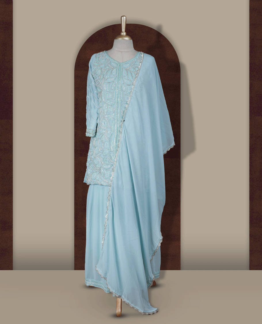 Elegant Ice blue colour embroidered sharara set featuring intricate sequins and cut beads work, paired with a soft matching dupatta edged with delicate detailing and a beautifully flared bottom for a graceful festive look.