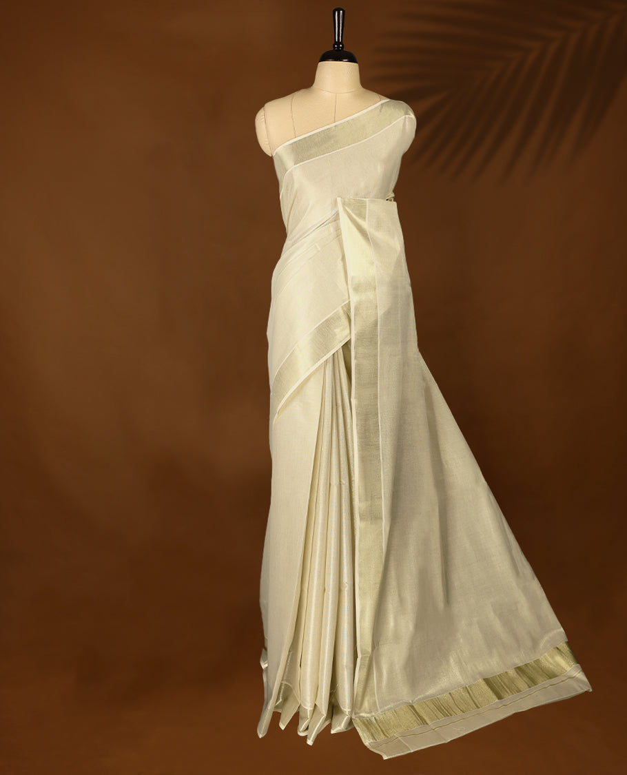 Light Gold colour Tissue Kerala saree featuring Plain body and a beautifully woven light Gold Kasavu border, paired with a matching blouse perfect for festive occasions.