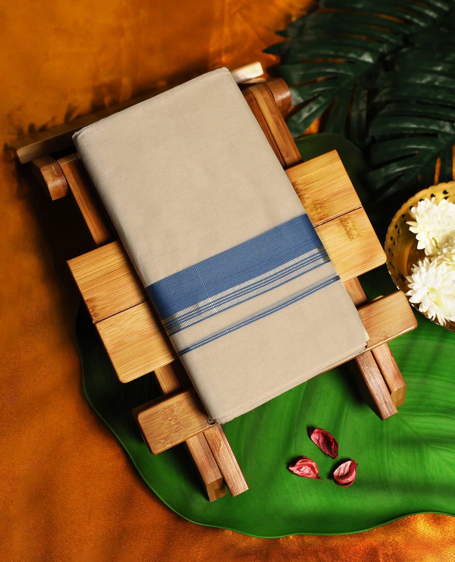Elegant light ivory colour pure cotton double dhoti featuring a classic sky blue border, crafted for traditional comfort and timeless style, perfect for festive and formal occasions.