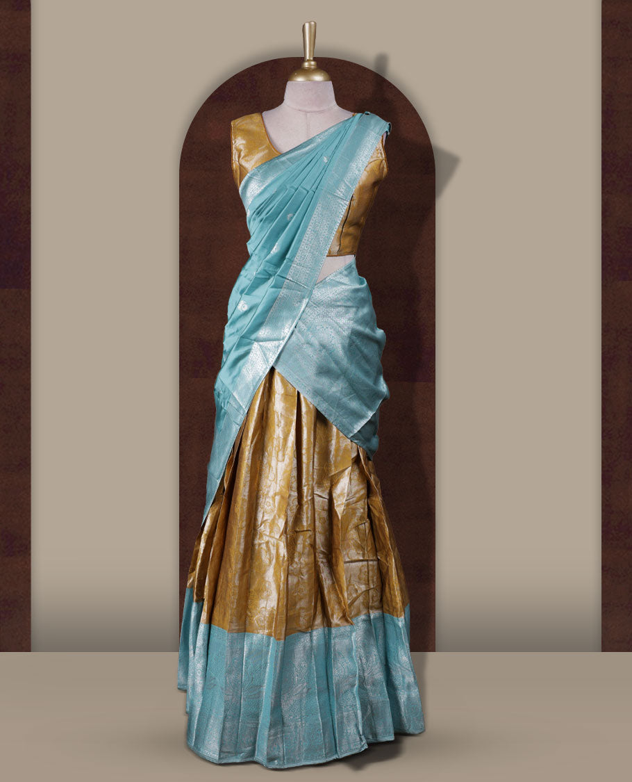 Ocean blue and mustard colour Dhavani set featuring a Mustard colour skirt with contrast ocean blue colour border with rich silver zari pattern & stone work, paired with a contrasting ocean blue dupatta detailed with silver motifs