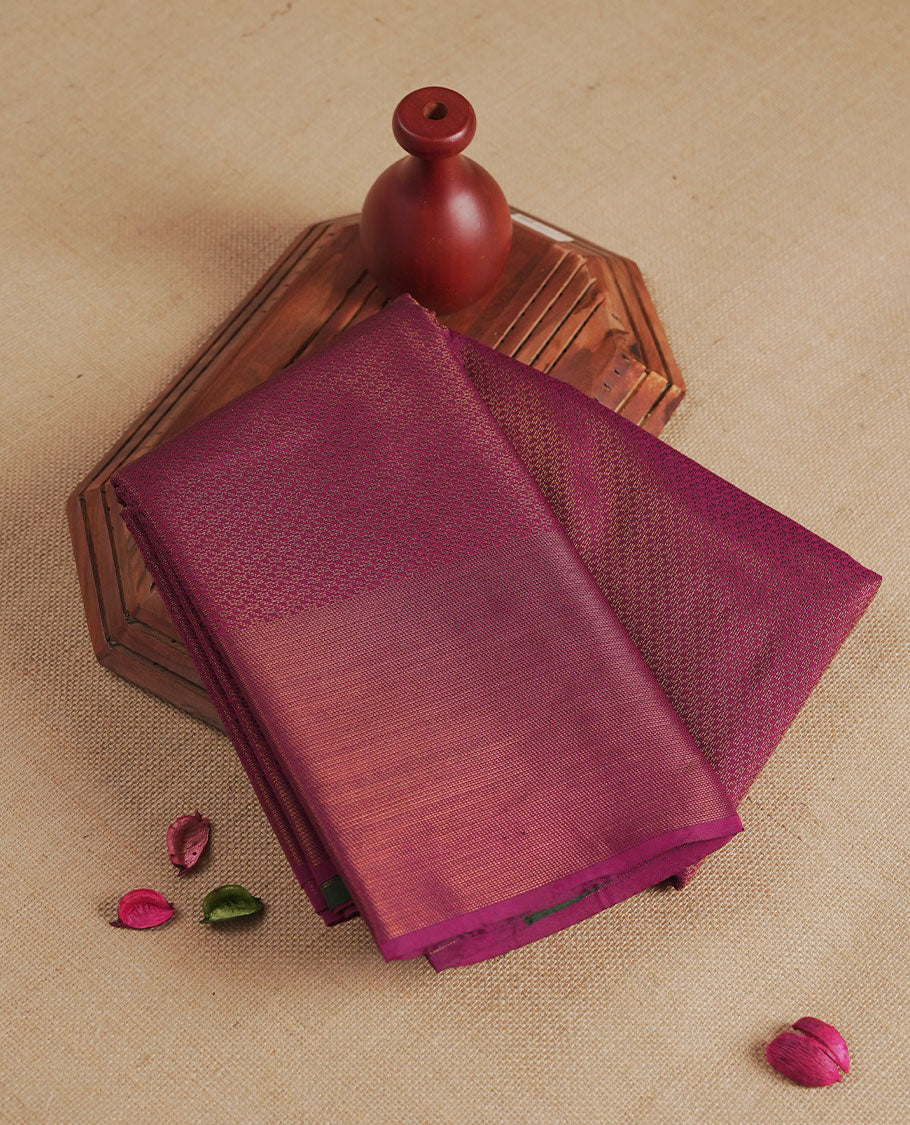 Plum colour semi silk saree featuring neem zari Brocade Pattern all over the body, complemented by a Self Colour woven border with detailing with contrast green Colour Pallu & blouse.