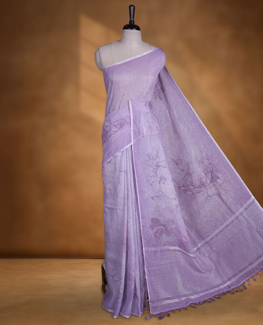 Lavender colour pure linen saree featuring Floral print pattern across body, silver thin border finished with matching blouse.