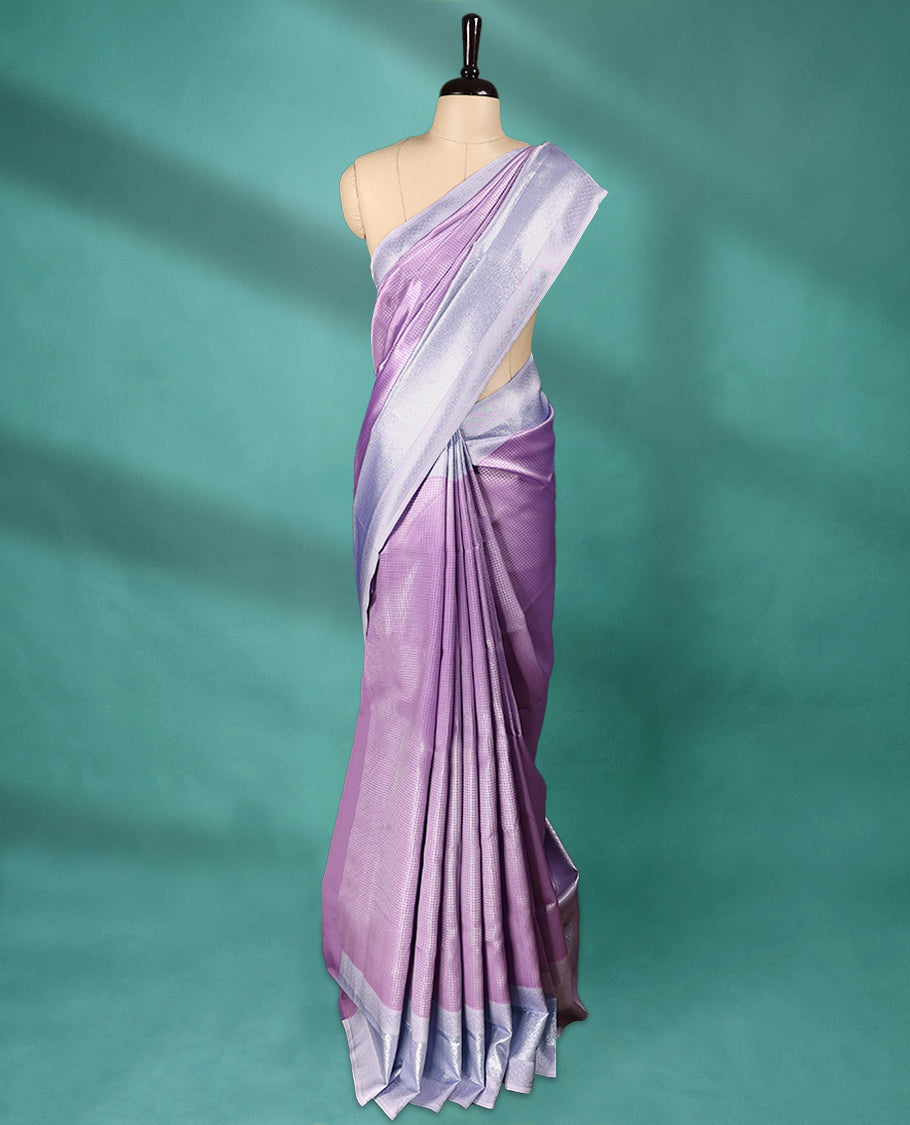 Violet coloured semi silk saree featuring a Check design on the body, paired with a Baby Blue coloured border and matching blouse.