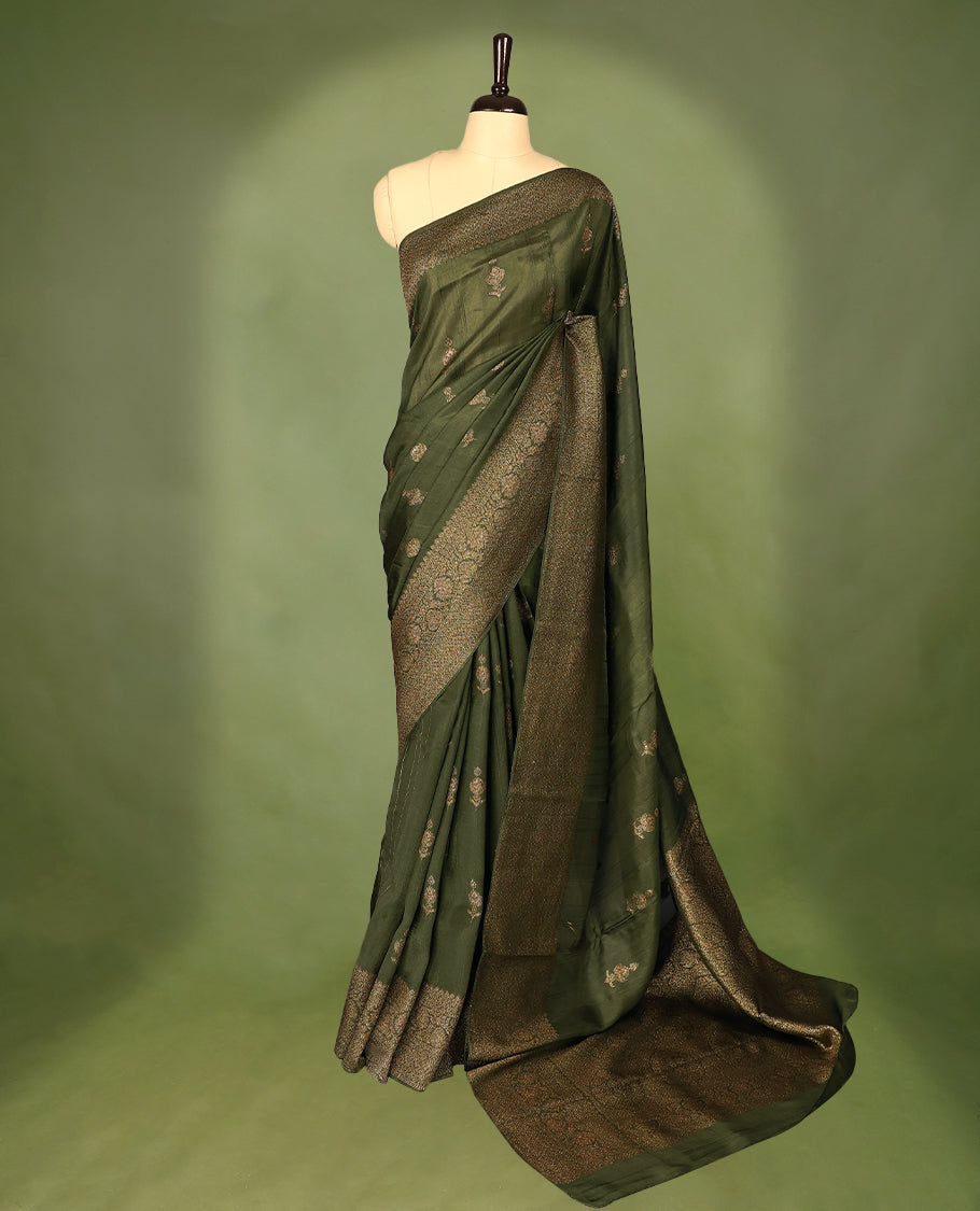 Army green semi-Banaras tussar georgette saree embellished with antique zari motifs across the body, complemented by a rich heritage Banaras border and paired with a matching blouse.