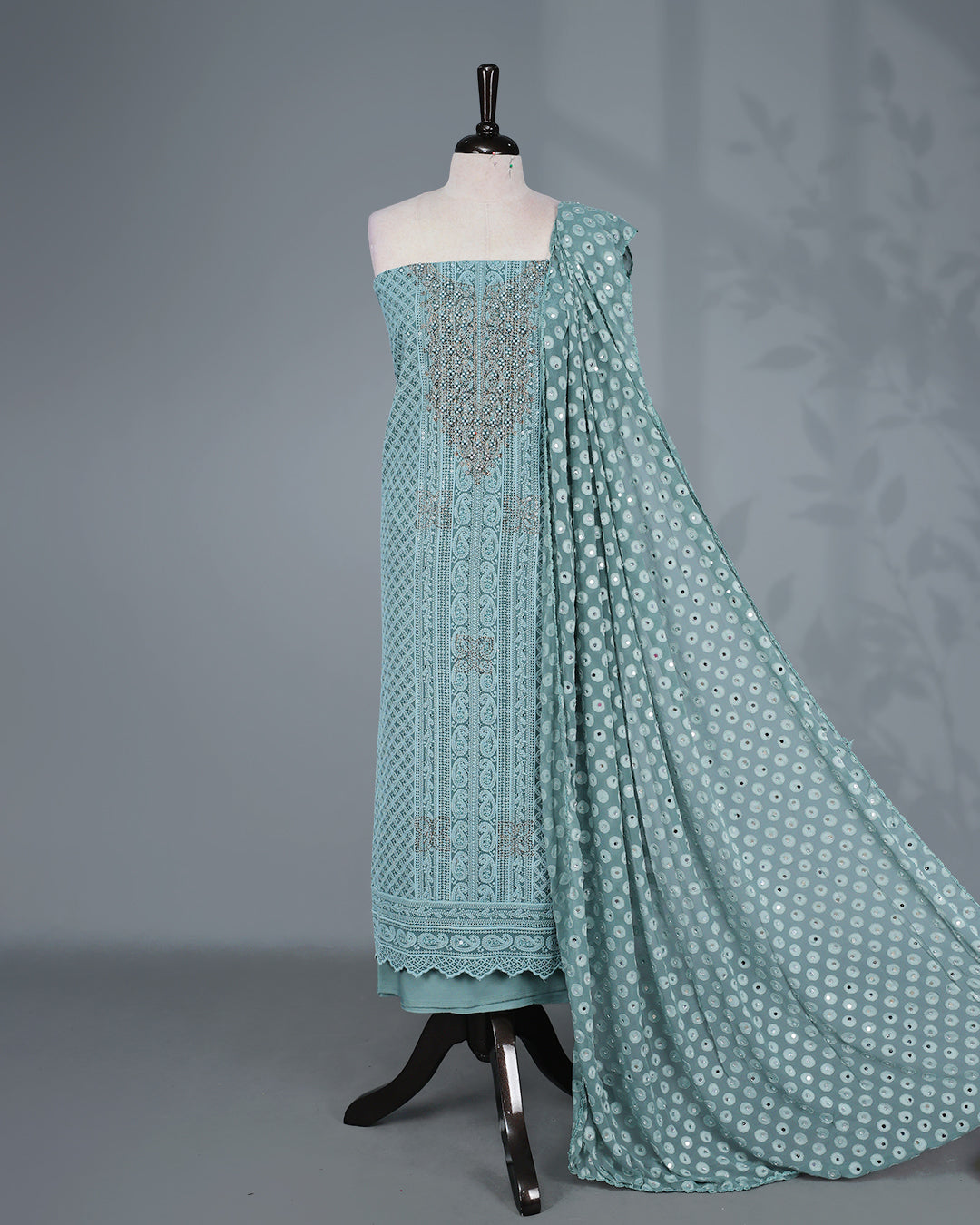 Sea Green Colour Georgette Salwar Material featuring elegant Chikankari work on the kurta, paired with a matching bottom and a sequins-embellished dupatta.