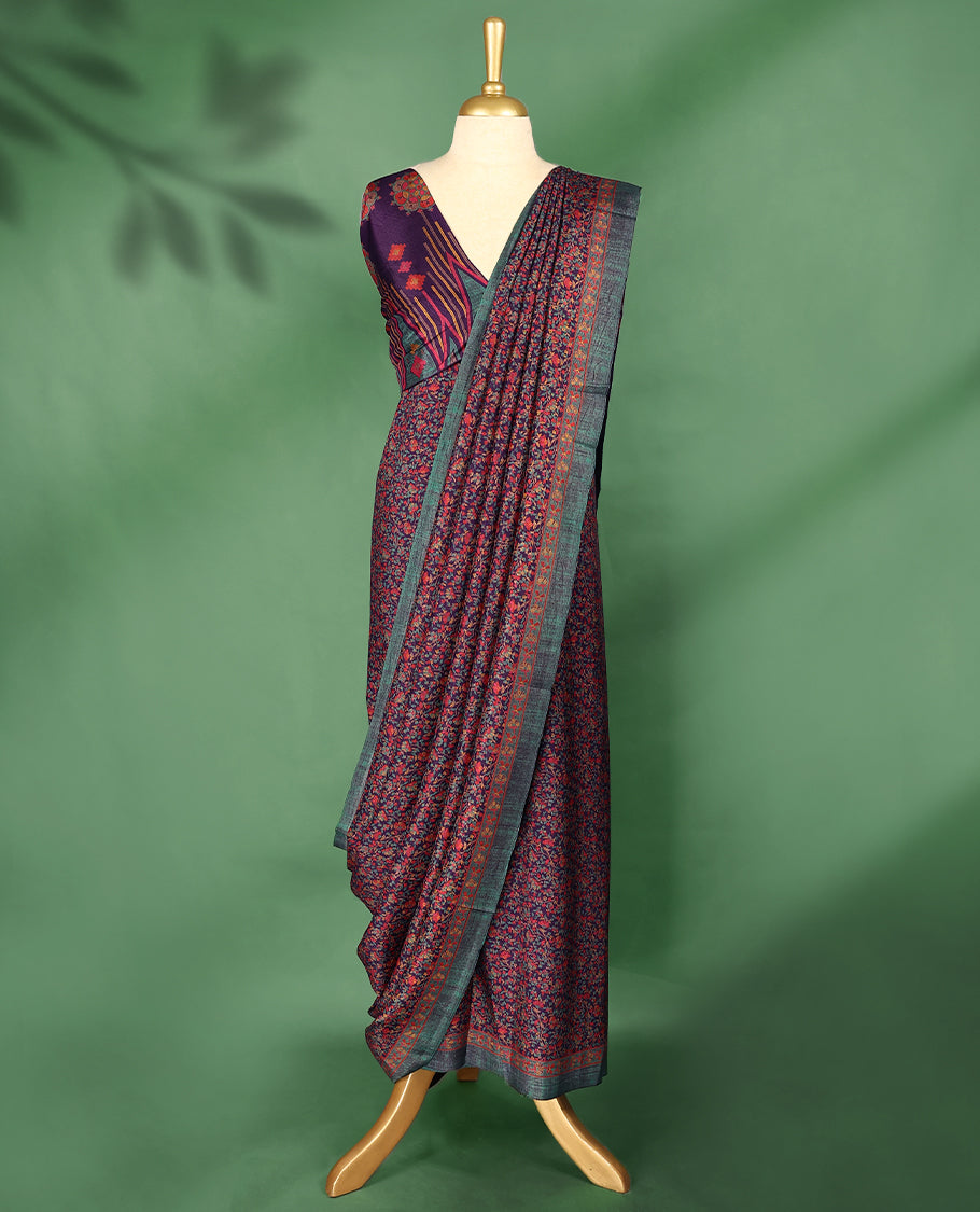 Deep Purple colour Manipuri saree featuring intricate all over floral motifs in vivid tones, framed with a teal and rust red woven border and a matching blouse.