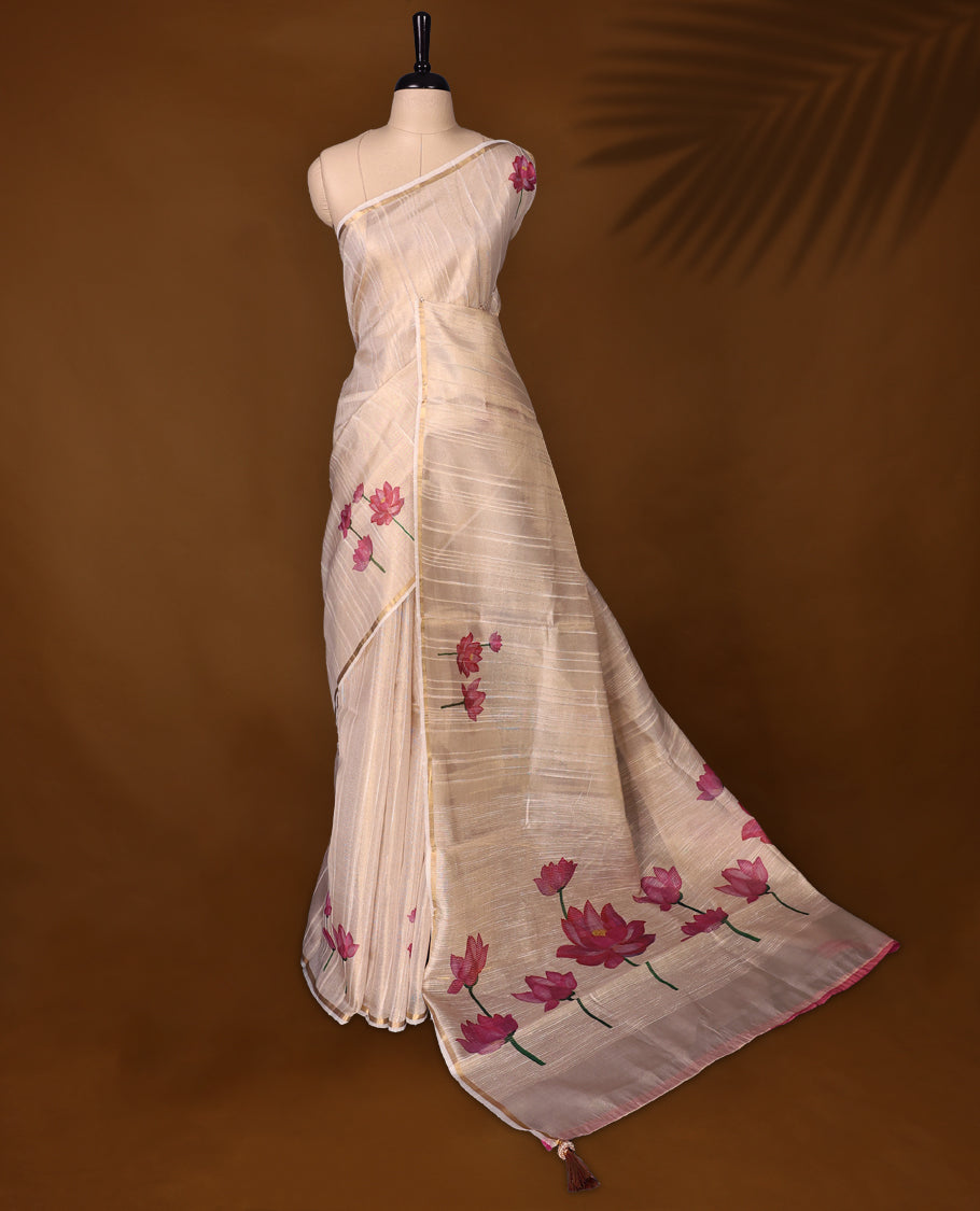 Ethereal off white colour organza Kerala saree adorned with hand painted pink lotus motifs and a subtle zari style border, Lightweight and graceful, paired with a matching blouse & perfect for festive celebrations and elegant gatherings.