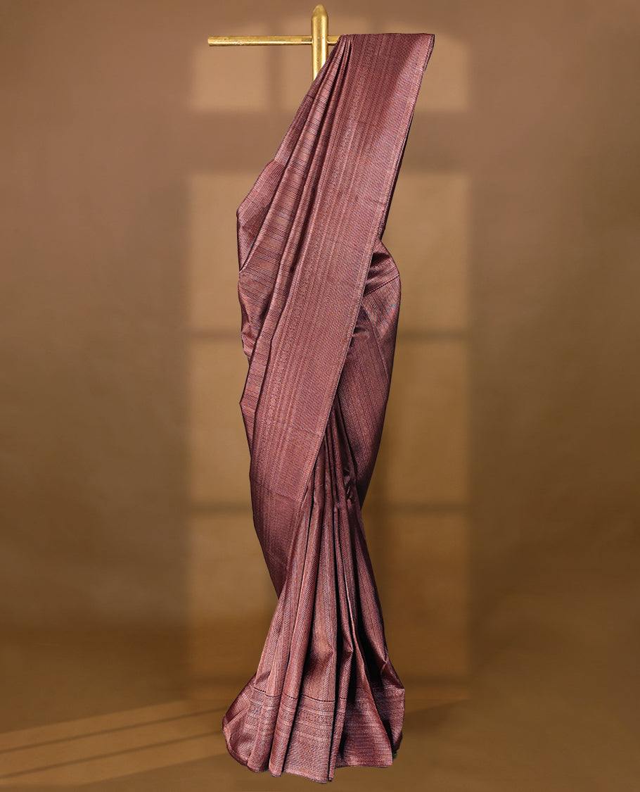 Maroon Colour Manthrakodi saree featuring an antique zari brocade body, complemented by a traditional Jada Naagam brocade border and a matching brocade blouse.