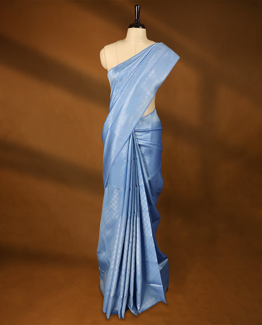 Sky Blue coloured semi silk saree featuring a Silver coloured Zari Diamond design on the body, paired with a Self coloured border and matching blouse.